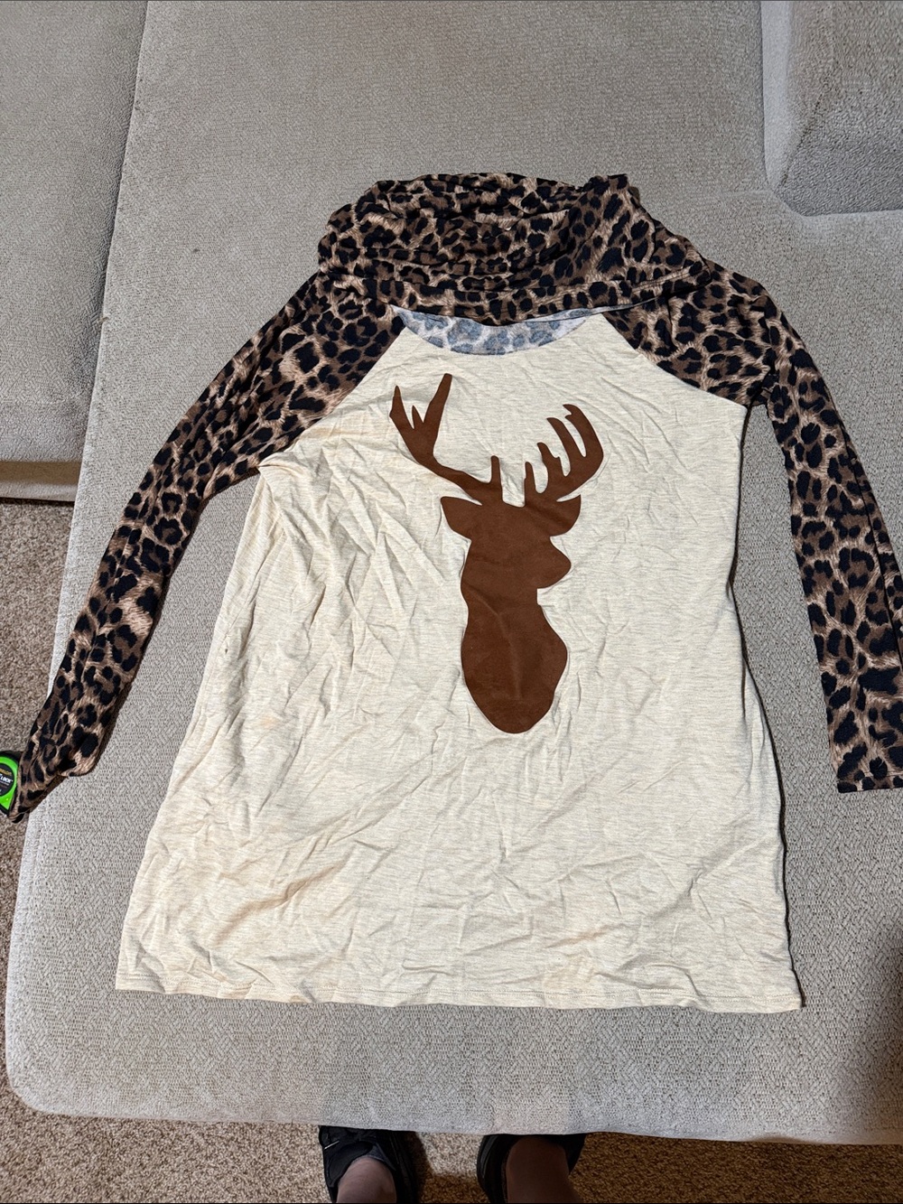 Cream turtle neck with Leopard Print Sleeves and Brown Deer Accent